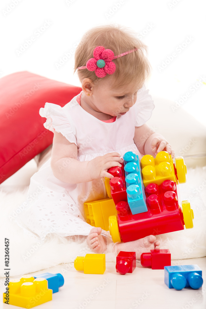 Baby girl playing with bricks Baby girl playing with bricks