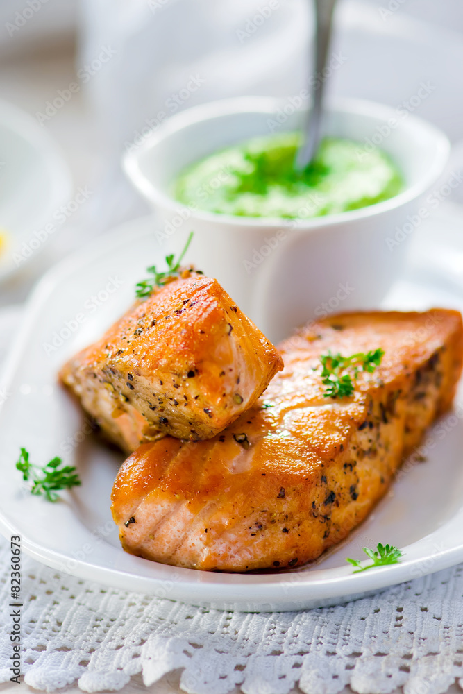 fried fillet of a salmon with green peas sauce