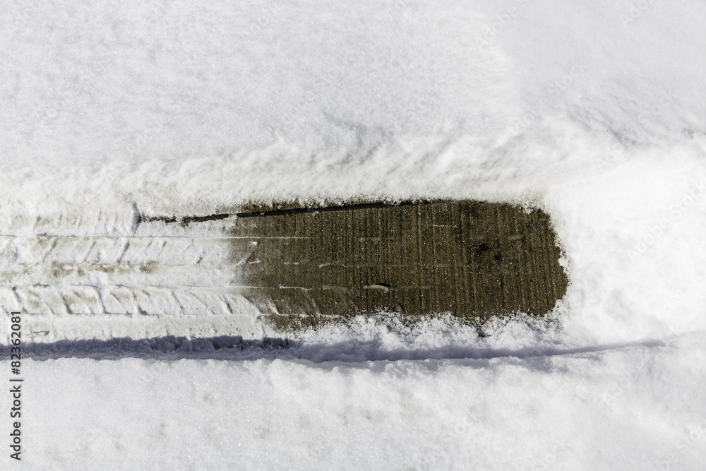 Car tire imprint in fresh winter snow
