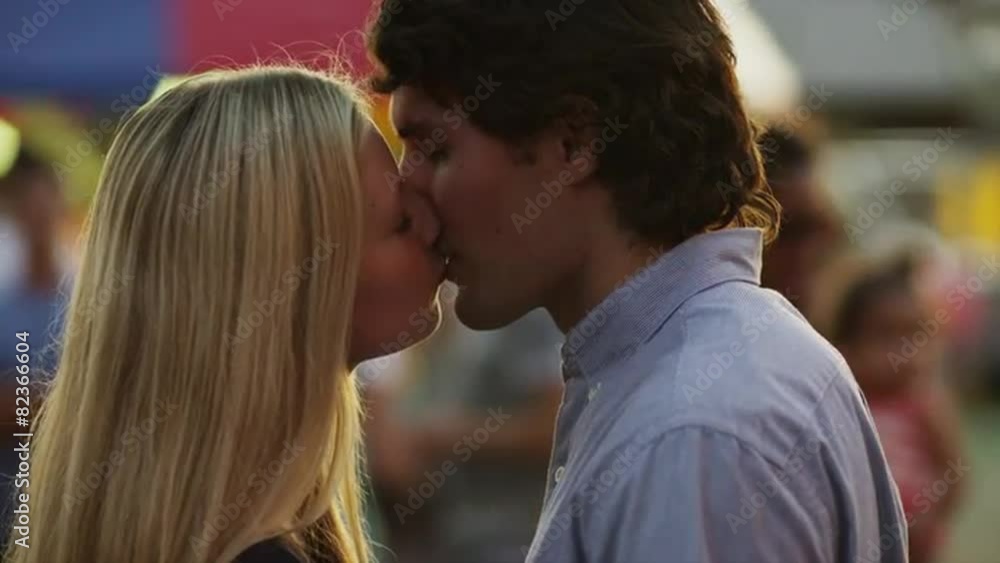 Close up, slow motion shot of young couple kissing / American Fork, Utah, United States Close up, slow motion shot of young couple kissing / American Fork, Utah, United States