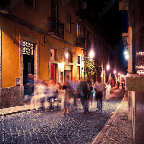 Group of People walking in Lisbon at night