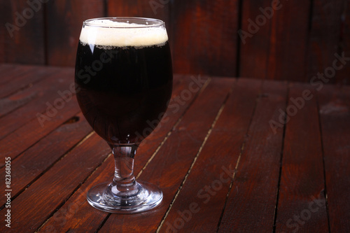 Dark beer on wood