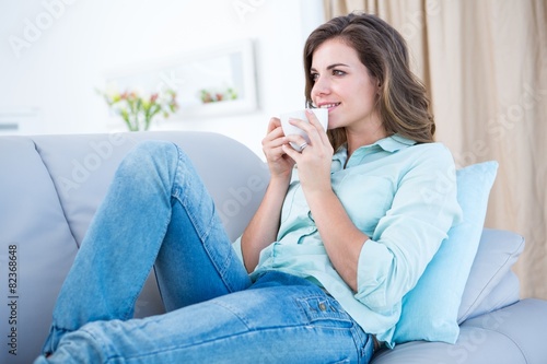 Peaceful woman drinking cup of coffee