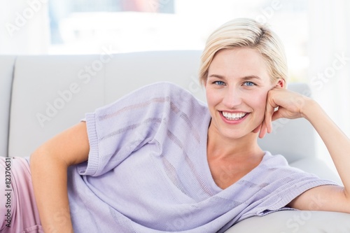 Pretty blonde woman relaxing on the couch