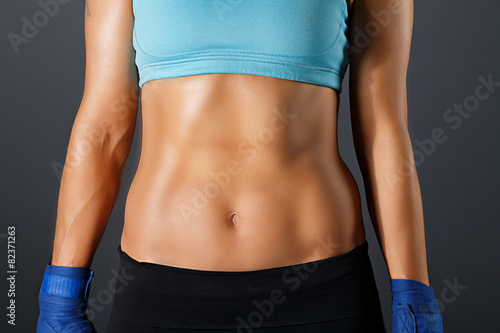 slim sportive woman torso with strong muscles