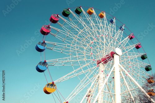 Giant ferris wheel against blue sky  Vintage