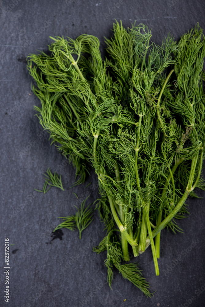 Spring garden fresh dill on black slate background Spring garden fresh dill on black slate background