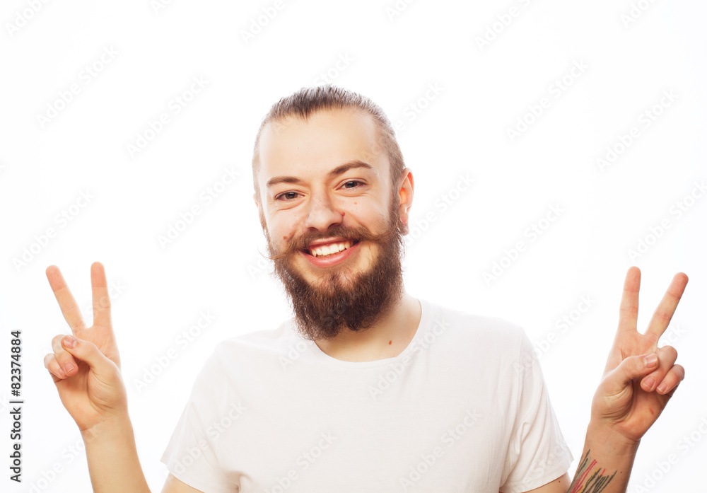 young bearded man with good idea sign. young bearded man with good idea sign.