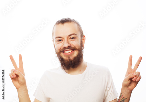 young bearded man with good idea sign.