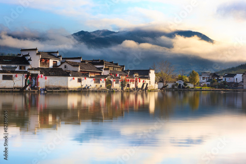 Chinese ancient village - Hongcun in mist photo