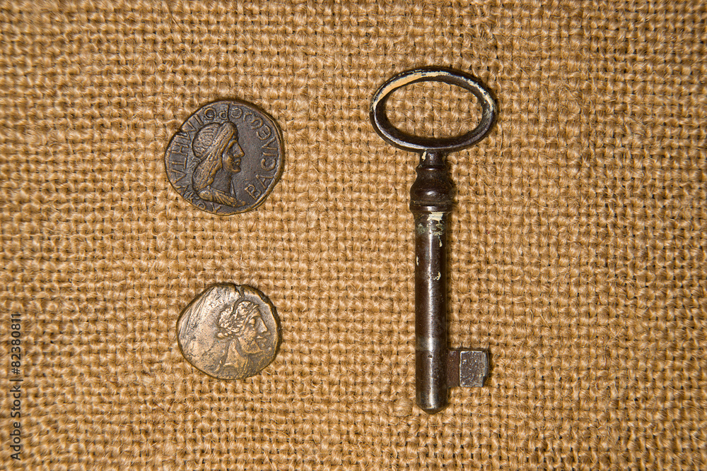 Antique coins and keys on old cloth Antique coins and keys on old cloth