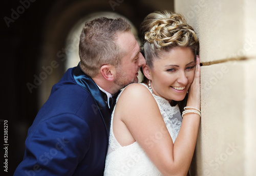 Wedding couple enjoying romantic moments in front of a castle