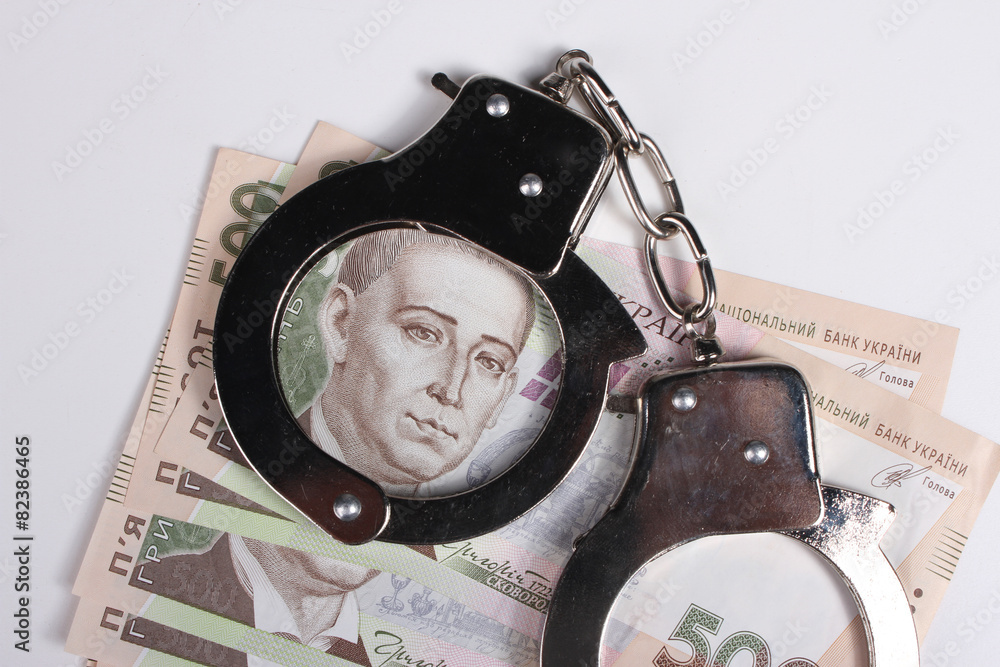 Criminal. Handcuffs and money. Corruption Criminal. Handcuffs and money. Corruption