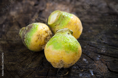 Fresh swedes on wooden background