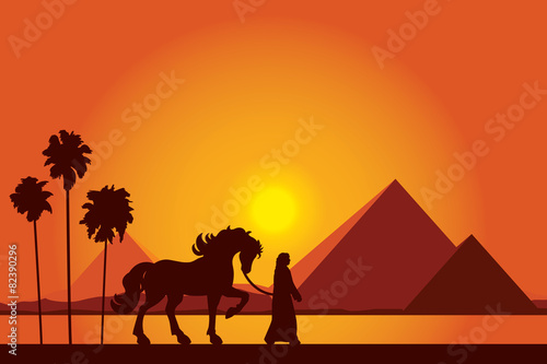Egypt Great Pyramids with silhouette of Bedouin and horse on sun