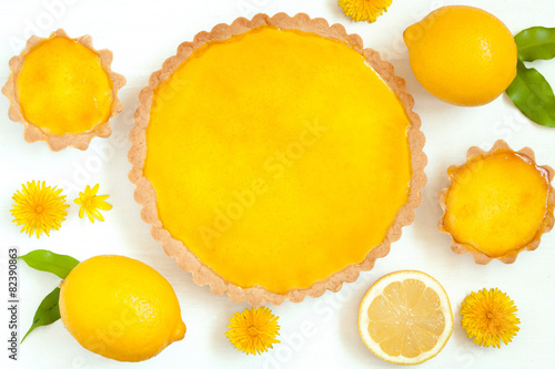 Tasty homemade backed lemon tart pie dessert with narcissus