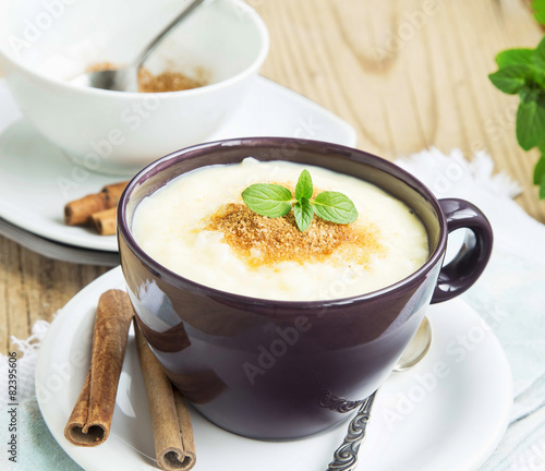 Rice Pudding with Cinnamon Powder and Mint Leaf