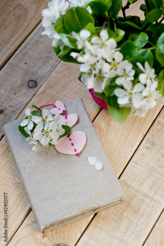 A bouquet of white spring flowers and old vintage notebook