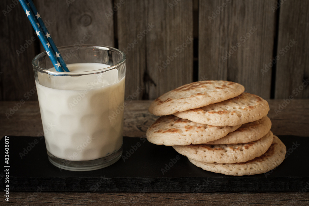 pancakes with milk on a gray background