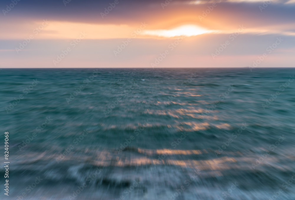 Blurred view of sunset across ocean