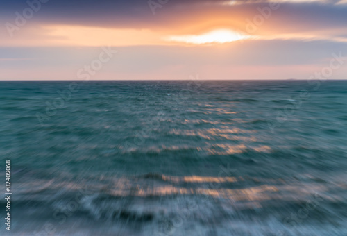 Blurred view of sunset across ocean © jovannig