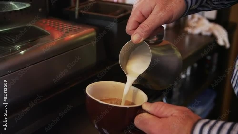 Close up of man pouring milk into coffee / Orem, Utah, United States, Close up of man pouring milk into coffee / Orem, Utah, United States,