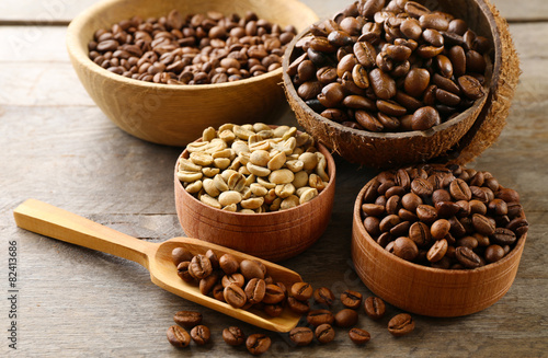 Various of coffee in small dishes on wooden table, closeup