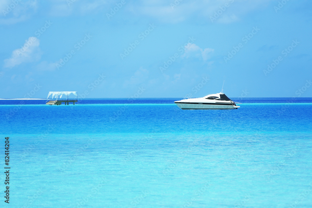 View of beautiful blue ocean water with ship in resort View of beautiful blue ocean water with ship in resort