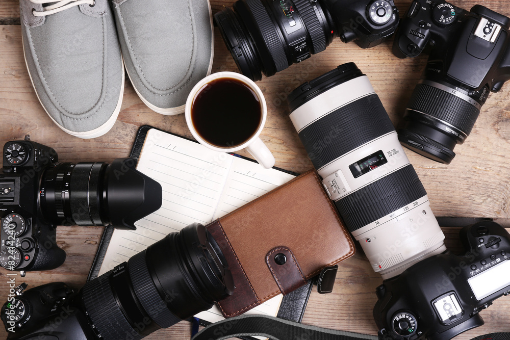 Still life with modern cameras on wooden table, top view Still life with modern cameras on wooden table, top view