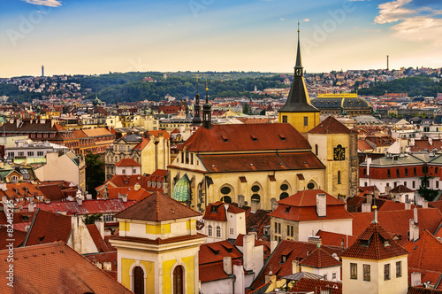 Houses with traditional red roofs in Prague Old Town Square in t