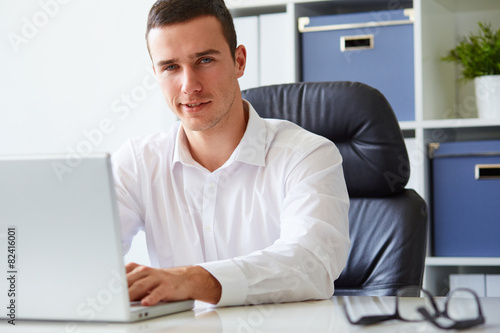 Young businessman working with laptop © Rostislav Sedlacek
