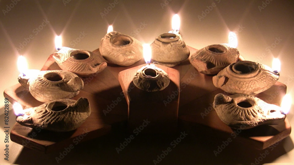 Hanukia made of ancient clay olive oil lamps Stock ビデオ Adobe Stock