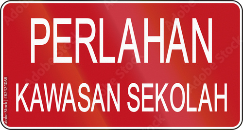 Road sign in Brunei  Perlahan - Kawasan sekolah Slow down - School area