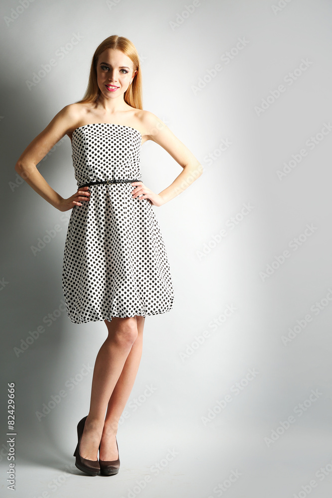 Expressive young model on gray background Expressive young model on gray background