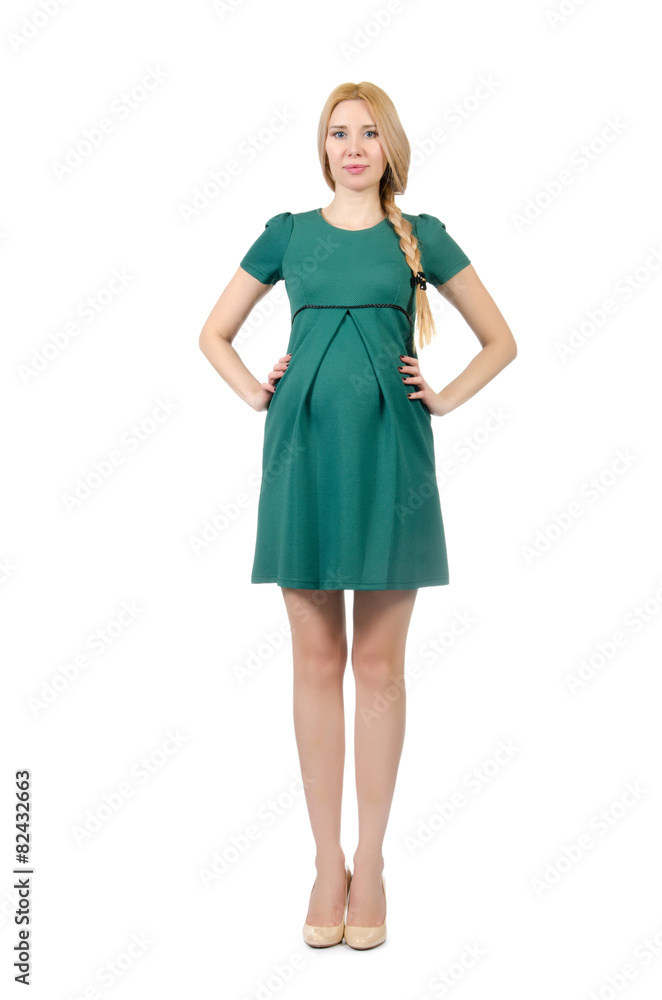 Beautiful pregnant woman in green dress isolated on white