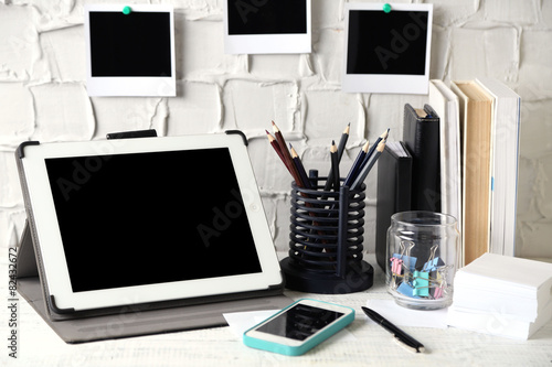 Stylish workplace with digital tablet at home or studio