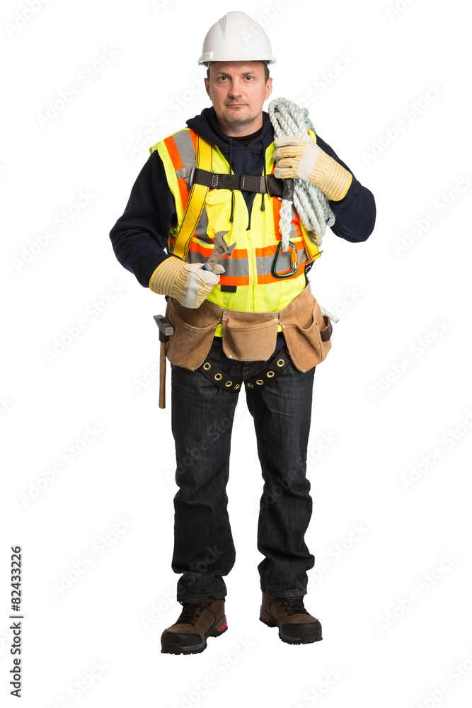 The man in a worker uniform and with building tools The man in a worker uniform and with building tools