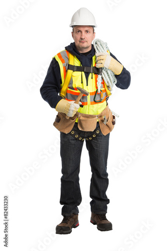 The man in a worker uniform and with building tools