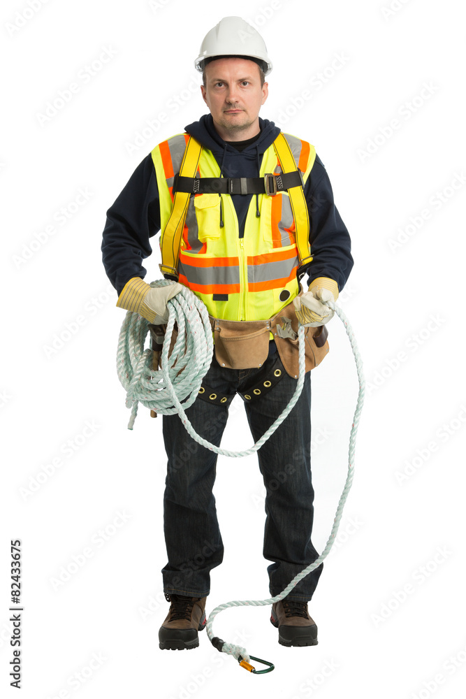 The man in a worker uniform and with building tools The man in a worker uniform and with building tools