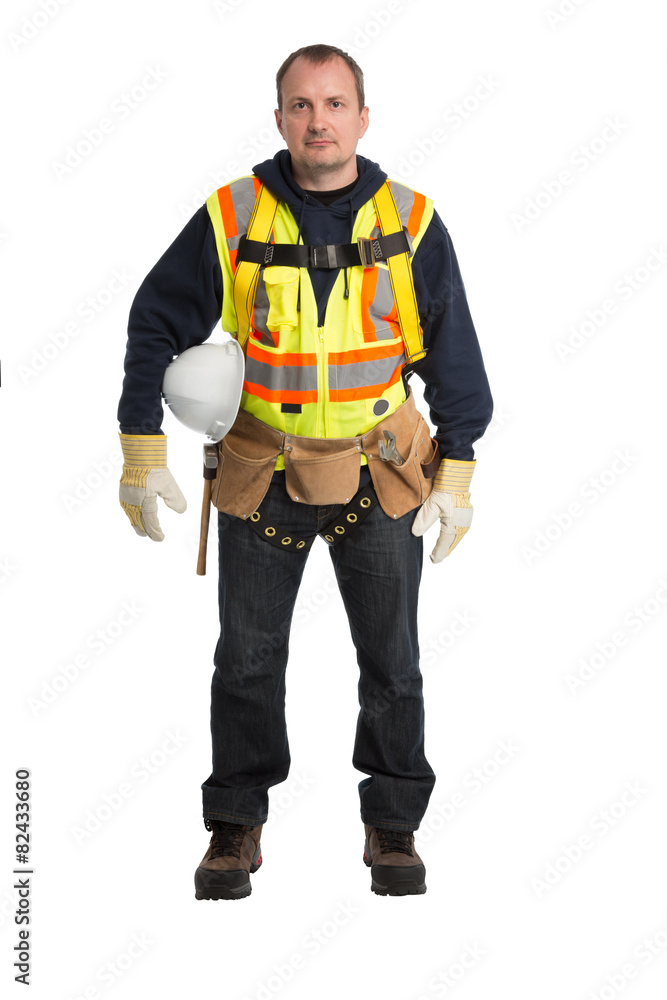 The man in a worker uniform and with building tools The man in a worker uniform and with building tools