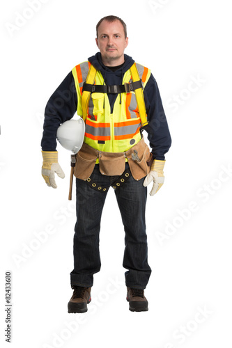 The man in a worker uniform and with building tools