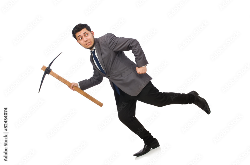 Young businessman holding a tool isolated on white Young businessman holding a tool isolated on white