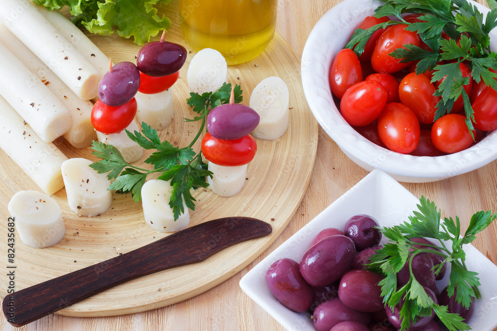 Canape of Heart of palm (palmito), cherry tomatoes, olives Canape of Heart of palm (palmito), cherry tomatoes, olives