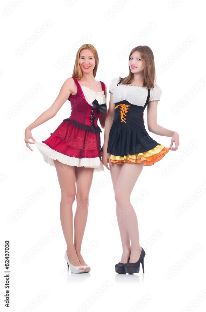 Girls in bavarian costumes isolated on white Girls in bavarian costumes isolated on white