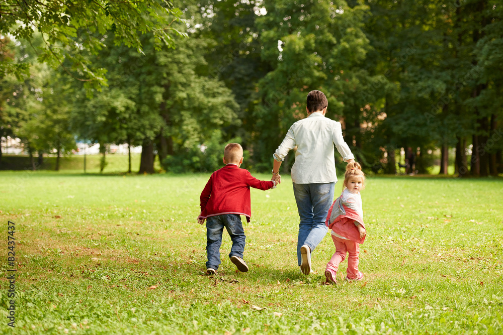 Fototapeta premium happy family playing together outdoor in park