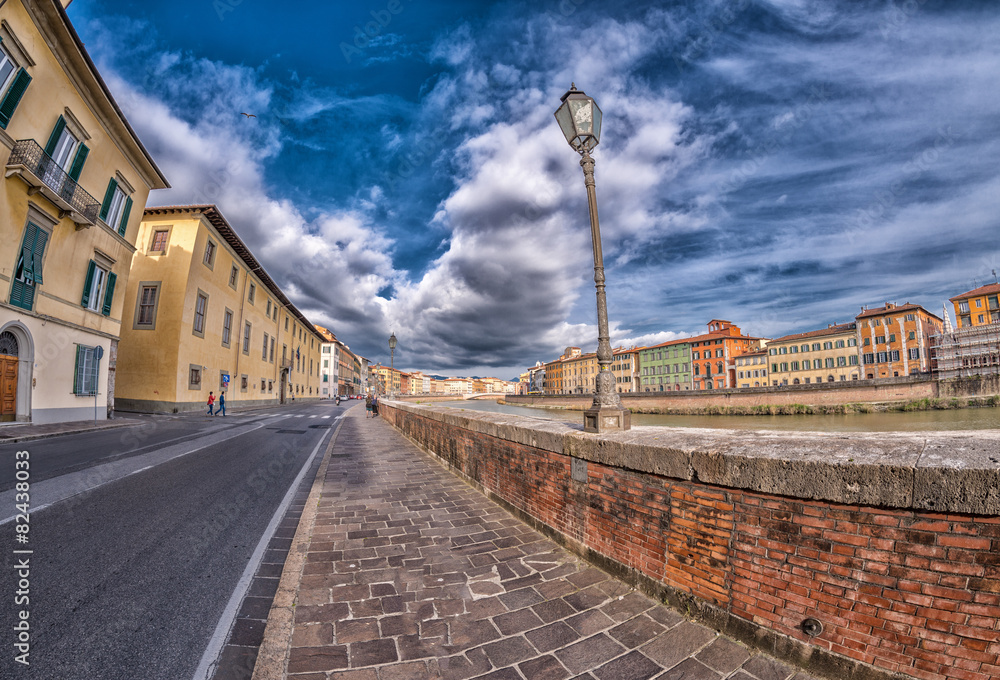 Medieval buildings of Pisa along Arno River - Tuscany, Italy