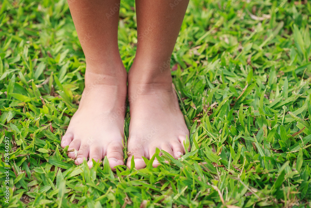 Children feet in the park