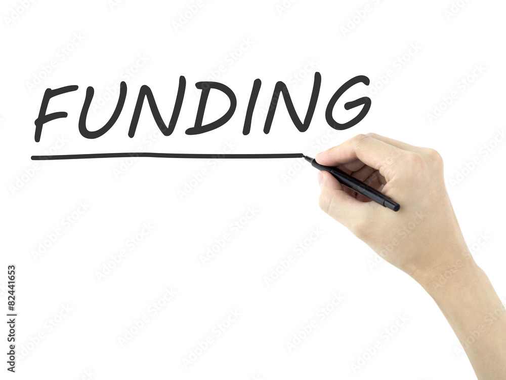 funding word written by man's hand funding word written by man's hand