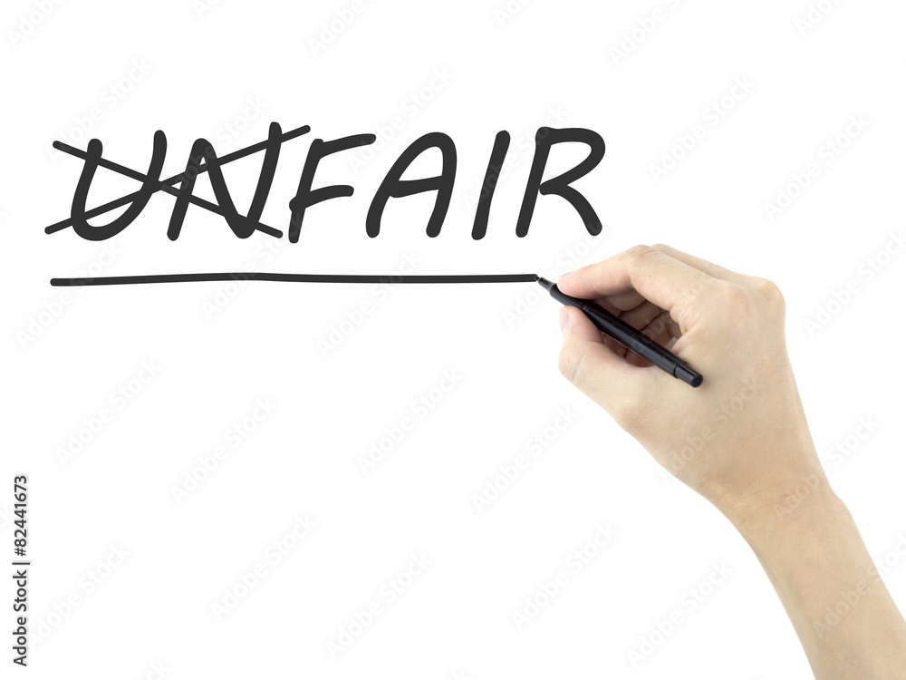 man's hand changing the word unfair into fair man's hand changing the word unfair into fair