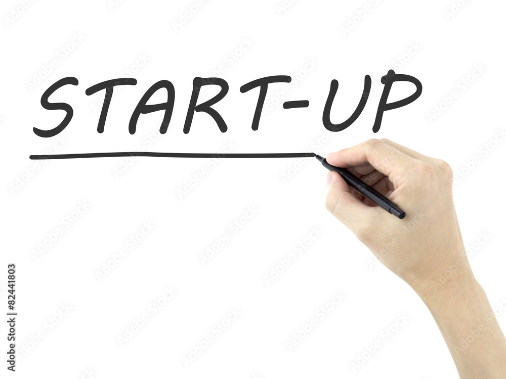 start-up word written by man's hand start-up word written by man's hand